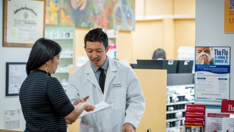 doctor and nurse discuss a patient's chart